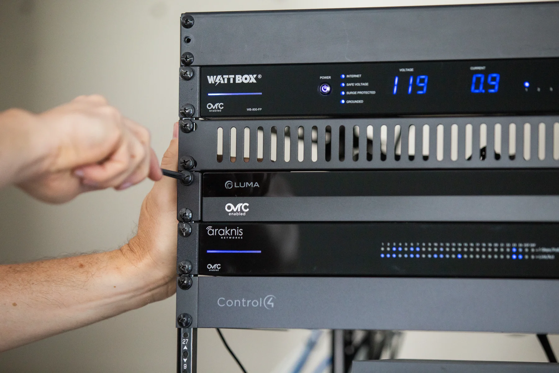 Close view of WattBox, Luma, Araknis, and Control4 rack-mounted equipment